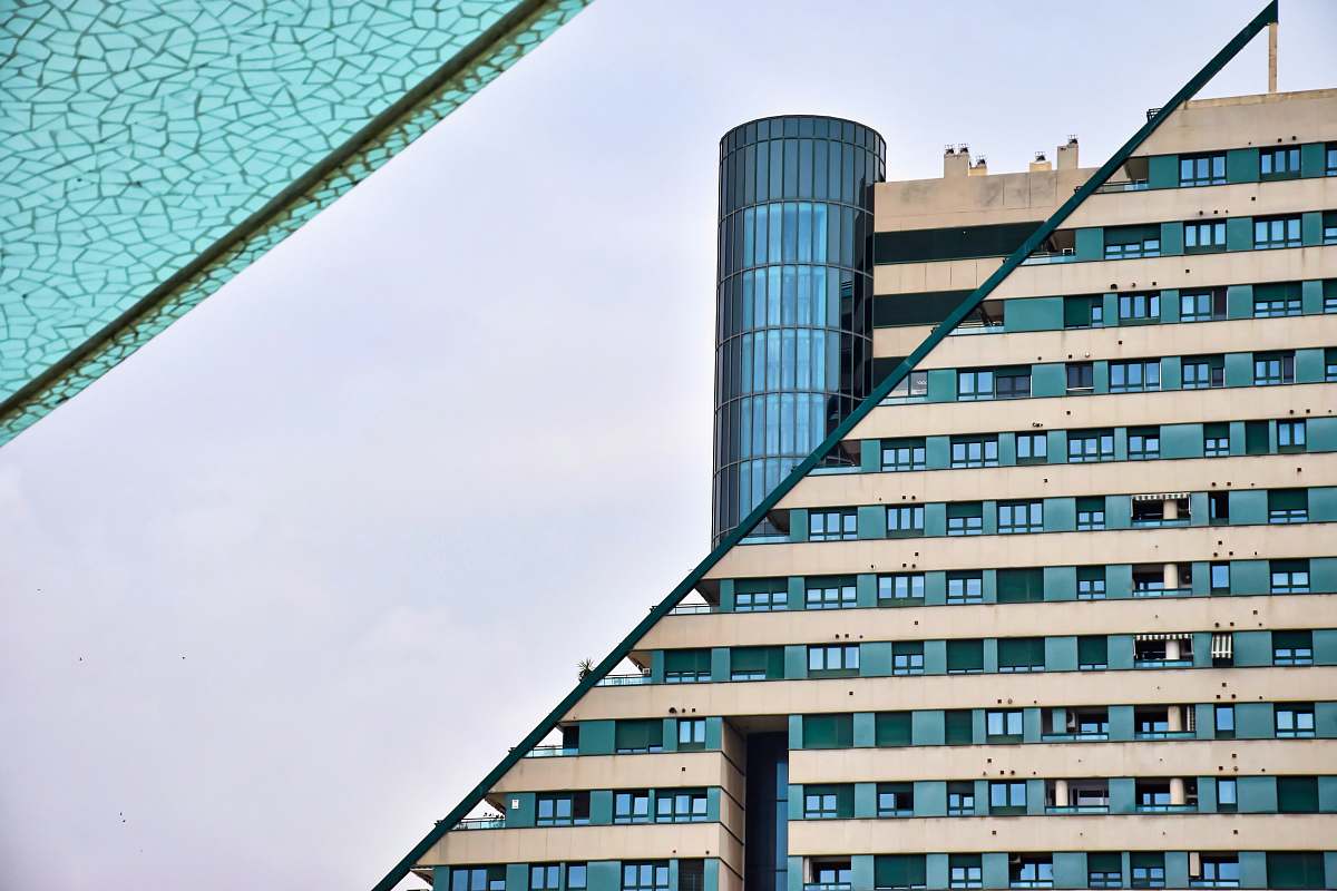 office building green and beige building facade city